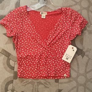 Billabong red crop top with white flowers